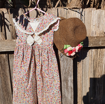 Floral dress hanging on fence